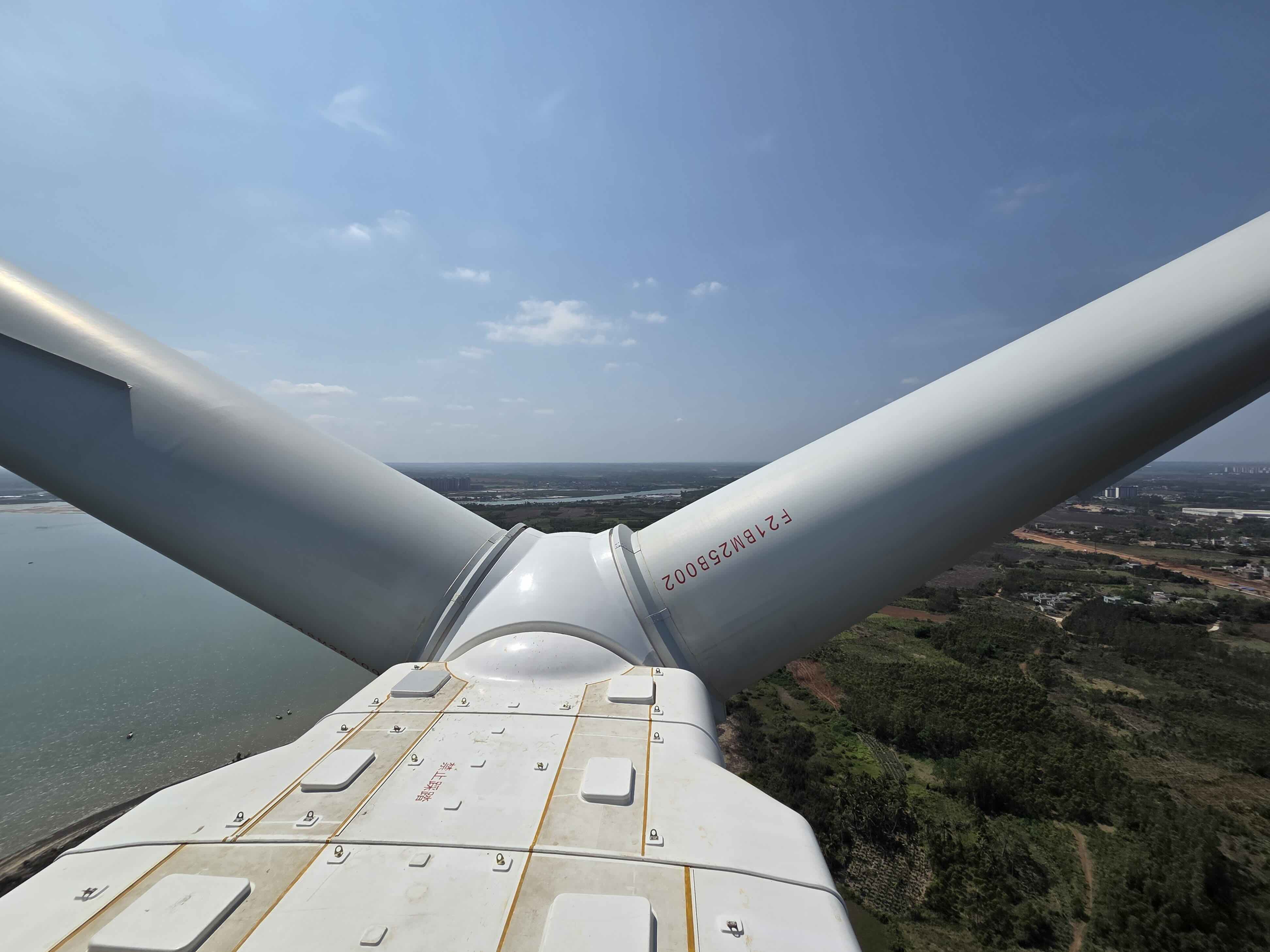 Wind turbine nacelle and blades above open water